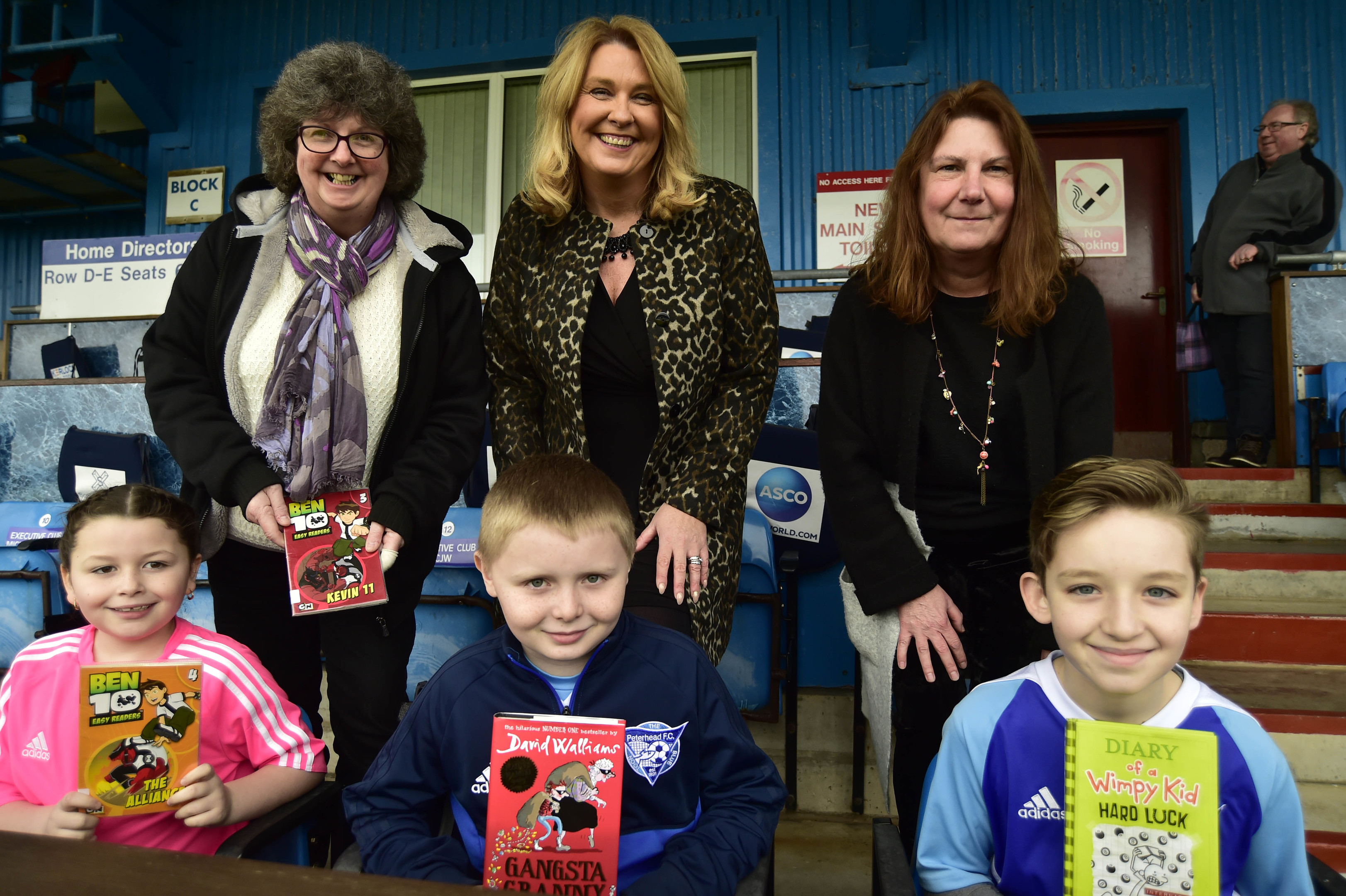 Launching the new reading initiative for children at Balmoor Stadium were  Cllr Gillian Owen, Cllr Dianne Beagrie and Jill Strachan. From Peterhead Library Emily Campbell, Cameron Beddie and Arran Thomson.