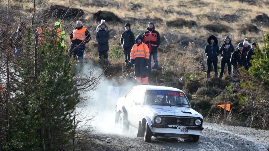 Colin Baxter of Tain and John Campbell of Invergordon make a lot of smoke in their Ford Escort.