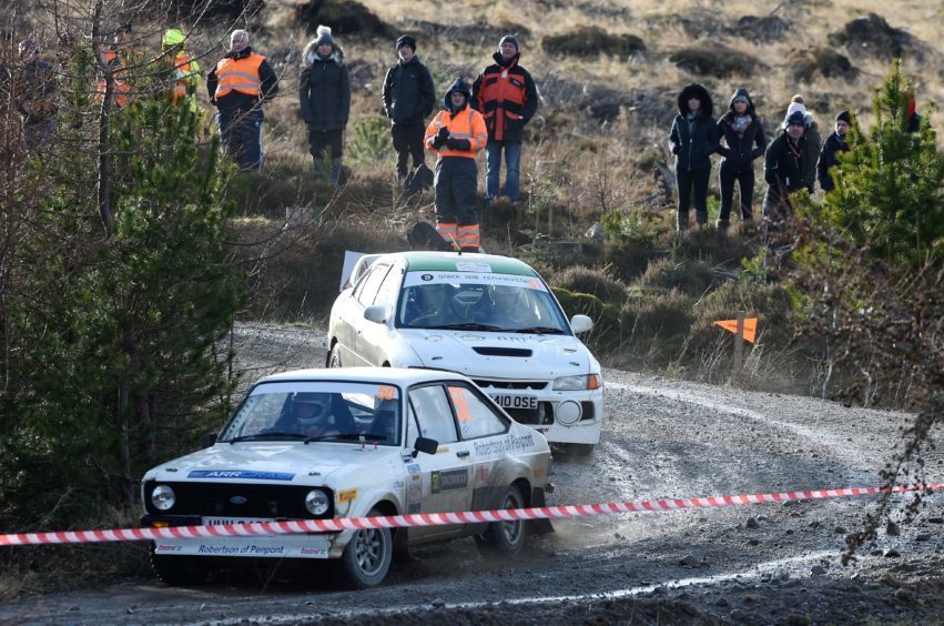 Jim Robertson of Penport is caught by Ian Petrie of Muir of Ord and Alan Falconer of Inverness in their Mitsubishi.