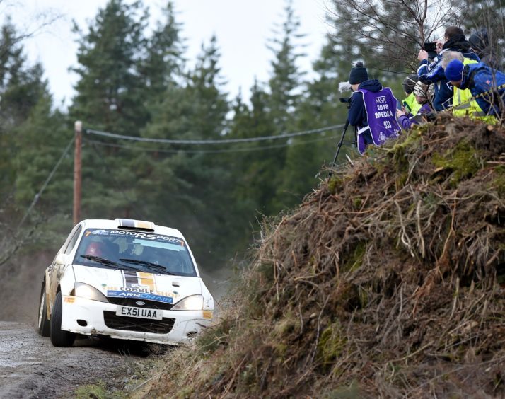 Close to the bank, eventual winners Andrew Gallacher of Hurlford and Jane Nicol of Edinburgh in their Ford Focus.