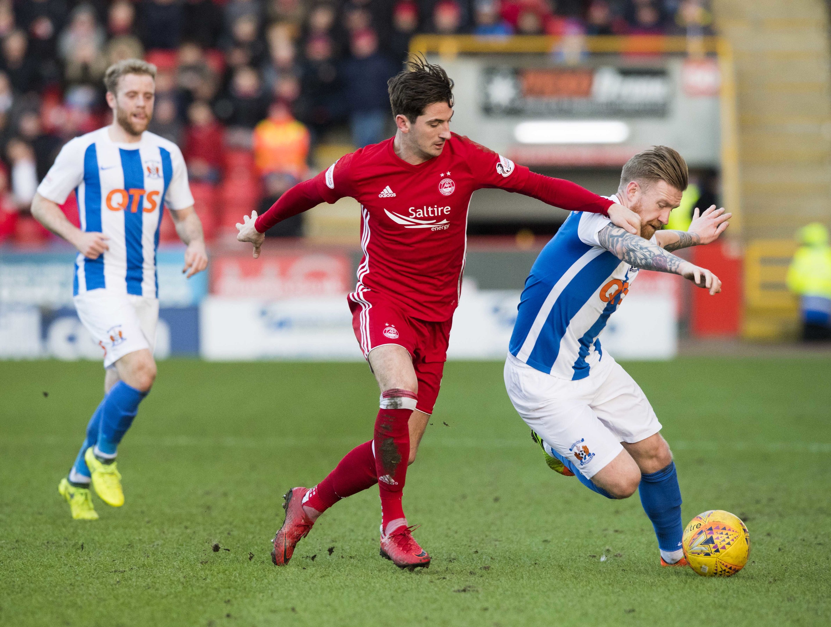 Kilmarnock's Rory Mackenzie and Aberdeen's Kenny McLean contest the ball at Pittodrie.