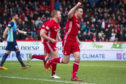 Aberdeen's Andrew Considine celebrates after making it 1-0.