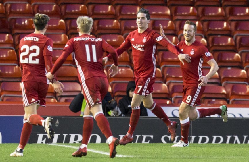 Aberdeen's Kenny McLean (7) celebrates his goal with Gary Mackay-Steven (11) Ryan Christie (22) and Adam Rooney (R)