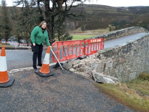 Councillor Geva Blackett inspects damage inflicted on the 18th century structure in 2018