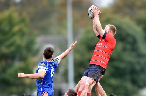 Grammar's Greig Ryan reaches high.