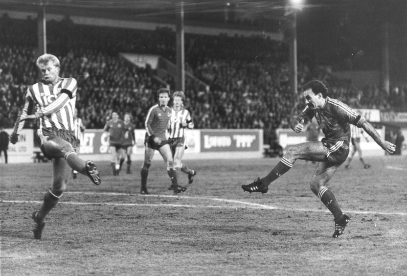 Dons Skipper Willie Miller crashes the ball into the Gothenburg net for the opening goal.