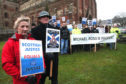 Michael Ross's parents Moira and Eddie Ross lead a silent vigil outside the St Magnus cathedral in Kirkwall.