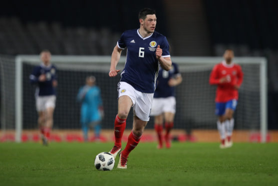 Scott McKenna was recalled to Scotland's starting line-up.
