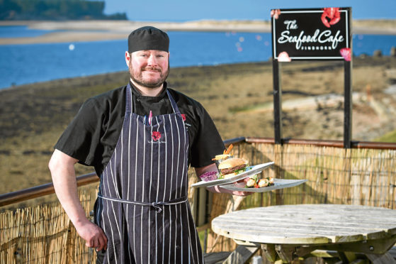 The Seafood Cafe owner Ian Mcghie with some of his dishes. Pictures by JASON HEDGES