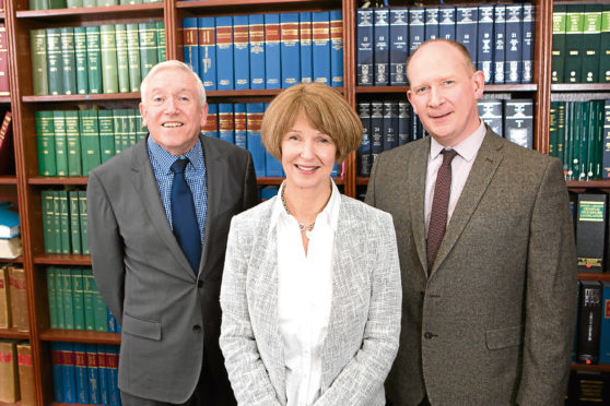 Bruce Miller, left,  of Munro &  Noble with Jill Miller and Alpin Stewart