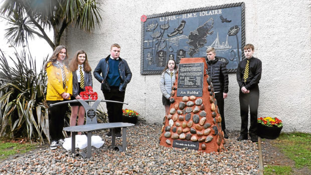 FROM MIKE MERRITT 07774637768.
Unveilling of the memorial cairn. 
It is a poignant tribute to one of Scotland's most heartbreaking losses of life.
 
Stones have been collected from the home village of each of the 201 sailors lost on the infamous Iolaire naval tragedy and will be incorporated into a unique memorial on the Isle of Lewis unveiled today