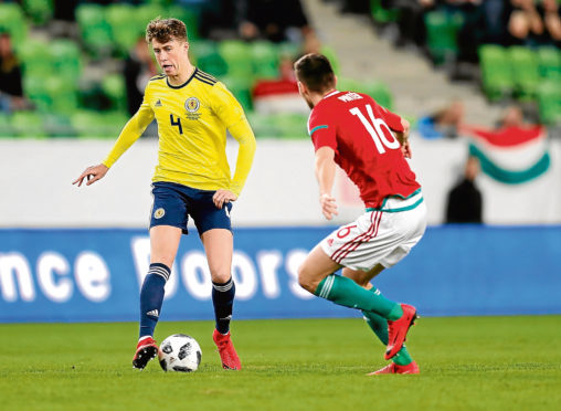 BUDAPEST, HUNGARY - MARCH 27: Adam Pinter of Hungary (r) and Jack Hendry of Scotland (l) in action during the International Friendly match between Hungary and Scotland at Groupama Arena on March 27, 2018 in Budapest, Hungary. (Photo by Laszlo Szirtesi/Getty Images)