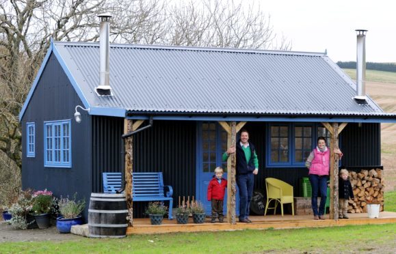 Jane and James Foad with children Hector, 2 and Freddie, 4 at their farm bothy at Newton of Begshill, Drumblade