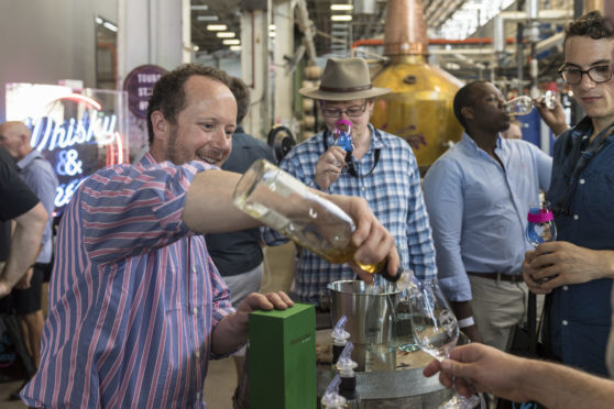 Master blender Alex Bruce of Adelphi pours out samples The Brisbane whisky, a blend of Scotch and Australian whisky