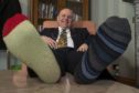 The Lord Provost of Aberdeen Barney Crockett wearing odd socks on World Down Syndrome Day 2018.