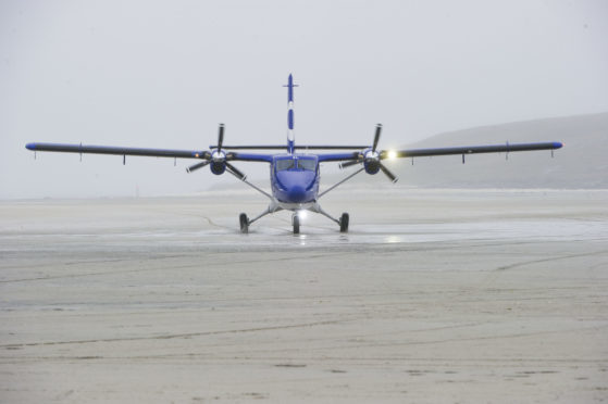 The new Twin Otter DHC6-400 aircraft taxiing along the beach runway on Barra, 19 June 2015.

Credit: Stuart Nicol Photography 2013.