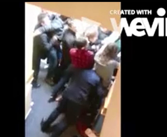 Angus Donaldson, Director of Estates and Facilities at the University of Aberdeen has been video recorded charging headfirst into a crowd of students and security staff, ramming students against the fire door they were being told to move away from. 