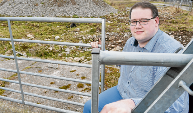 Highland councillor Andrew Jarvie at the site of the proposed housing development at Viewhill Farm