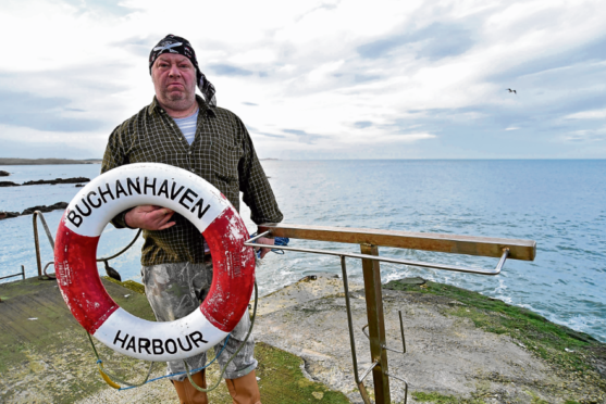 George Cameron with one of two remaining lifebelts at Buchanhaven