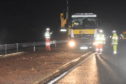 Emergency repairs were carried out last night to deal with the crater on the A90 near Laurencekirk which damaged many vehicles. Picture by Heather Fowlie.