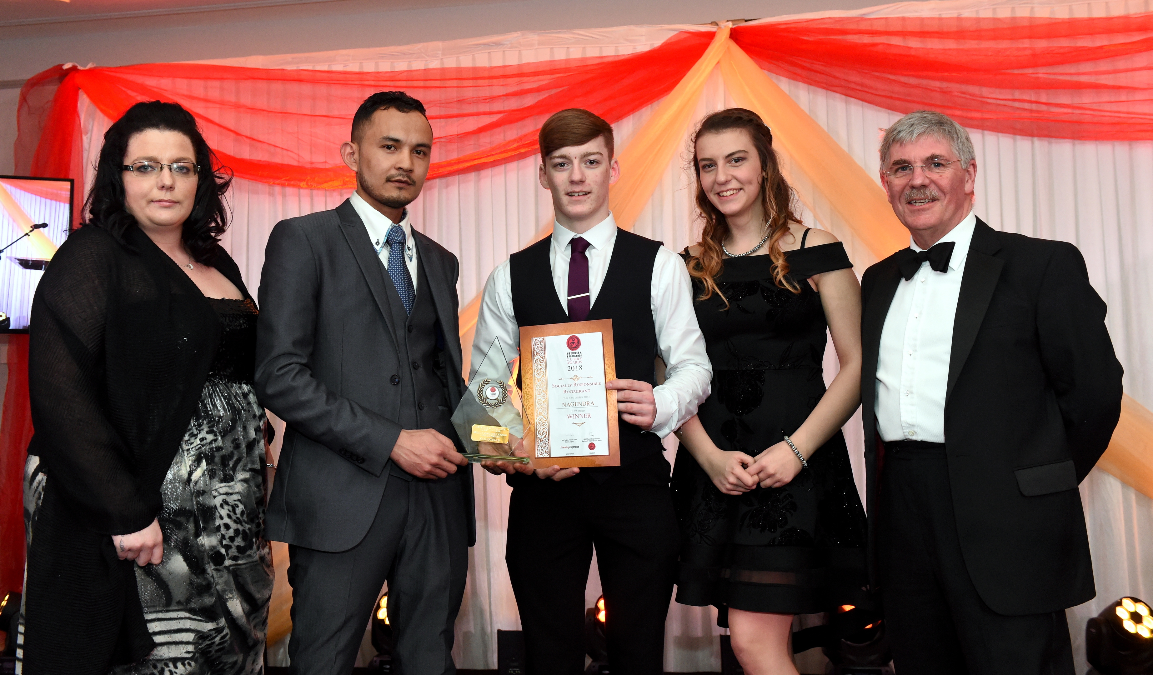 Pictured are the team from Nagendras collecting their award.