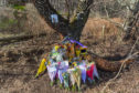 Tributes at the scene of the accident on the B9015 Mosstodloch to Rothes Road at Orton, Moray.