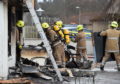 Fire crews remove equipment from the Forres Fish Bar.