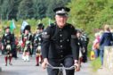 Jim Mitchell, the bobby on the bike, escorted the Lonach March