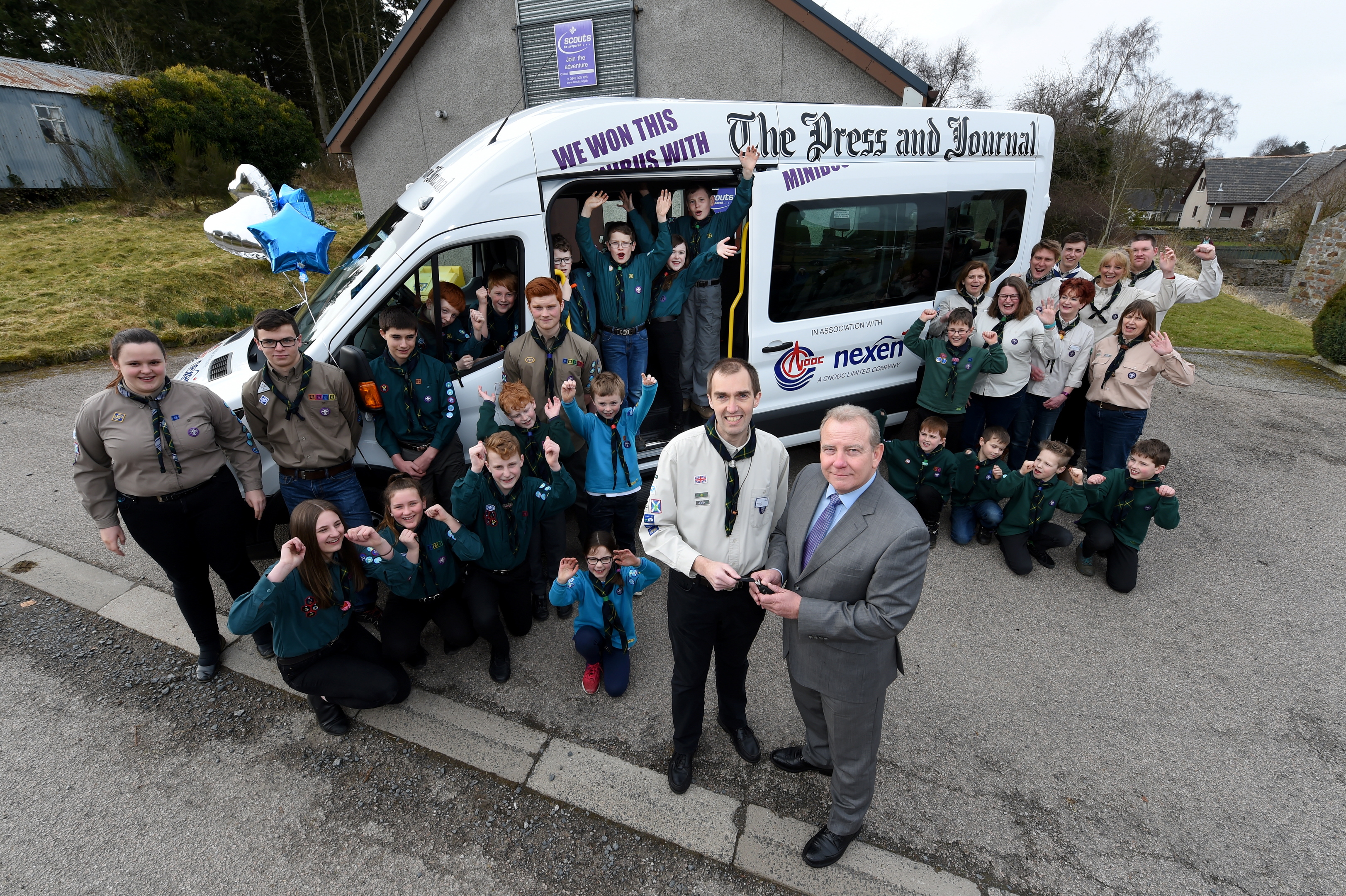 Minibus compition winners - 1st Methlick Scout Group, Methlick.
Picture of Methlick Scout Group and (centre L-R) Keith Hewitt (scouts) and Ray Riddoch (Nexen) during the handover.