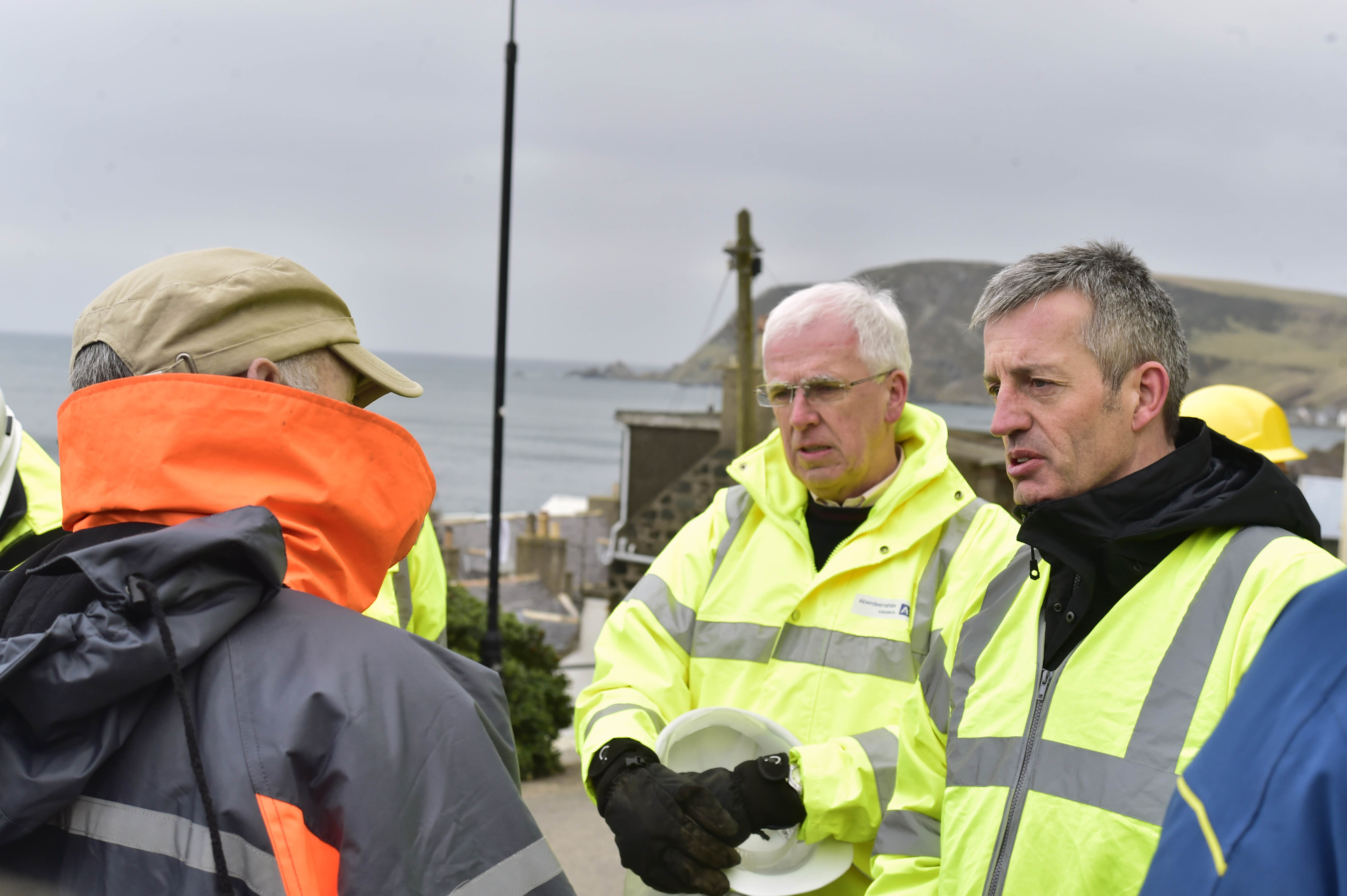 Aberdeenshire council leader Jim Gifford and CEO Jim Savegetalk to local resident Colin Wallek.