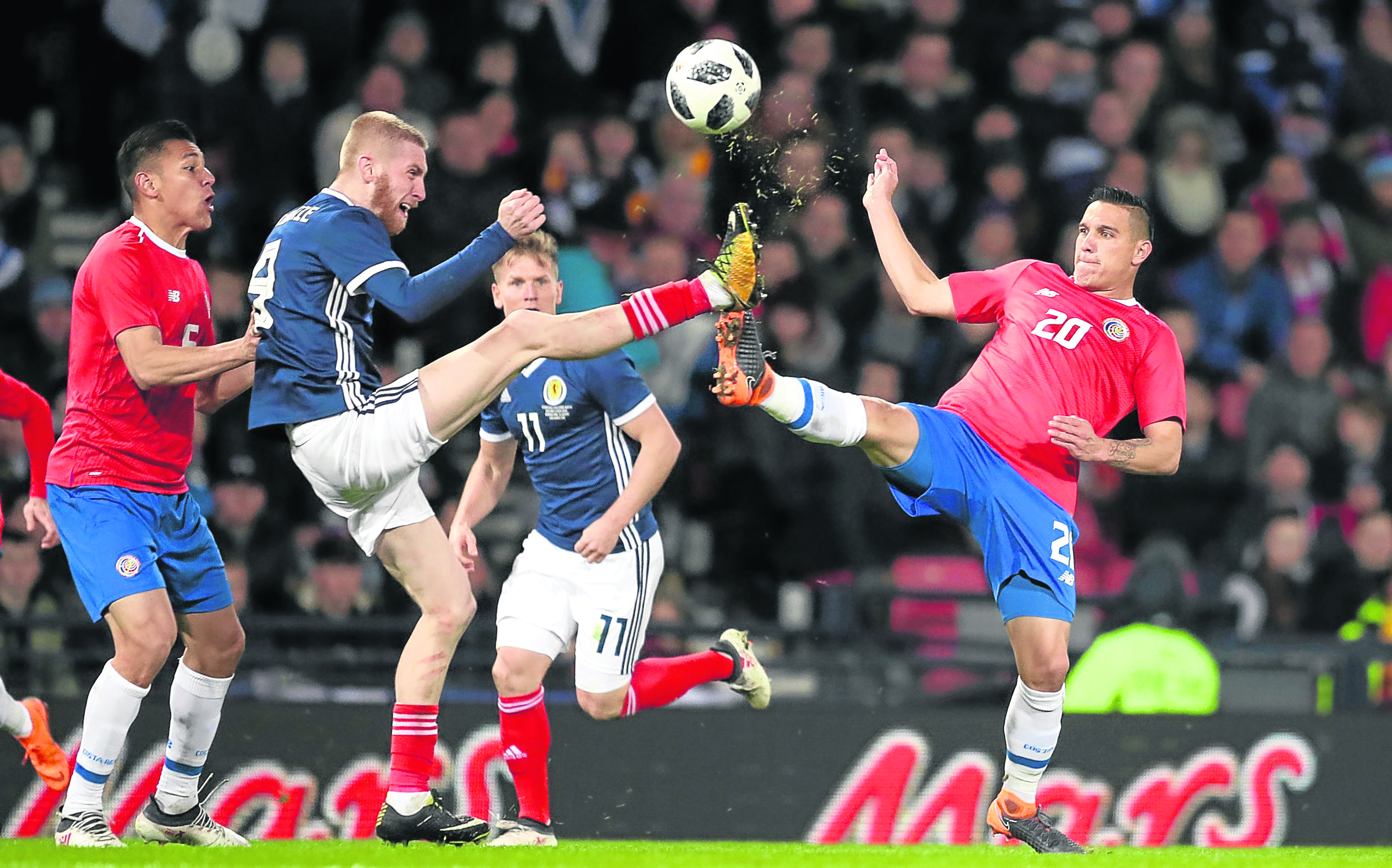 Scotland's Oliver McBurnie (left) and Costa Rica's David Guzman battle for the ball during the international friendly match at Hampden Park, Glasgow.
