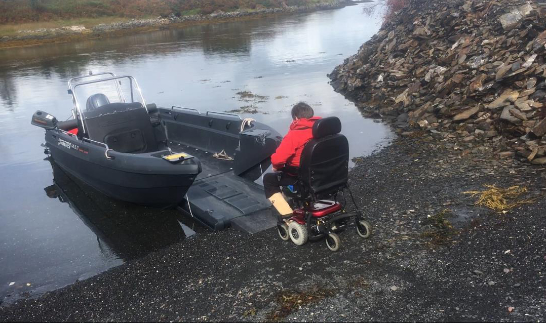 Graham MacQueens wife Morven boarding the boat in her electric wheelchair.