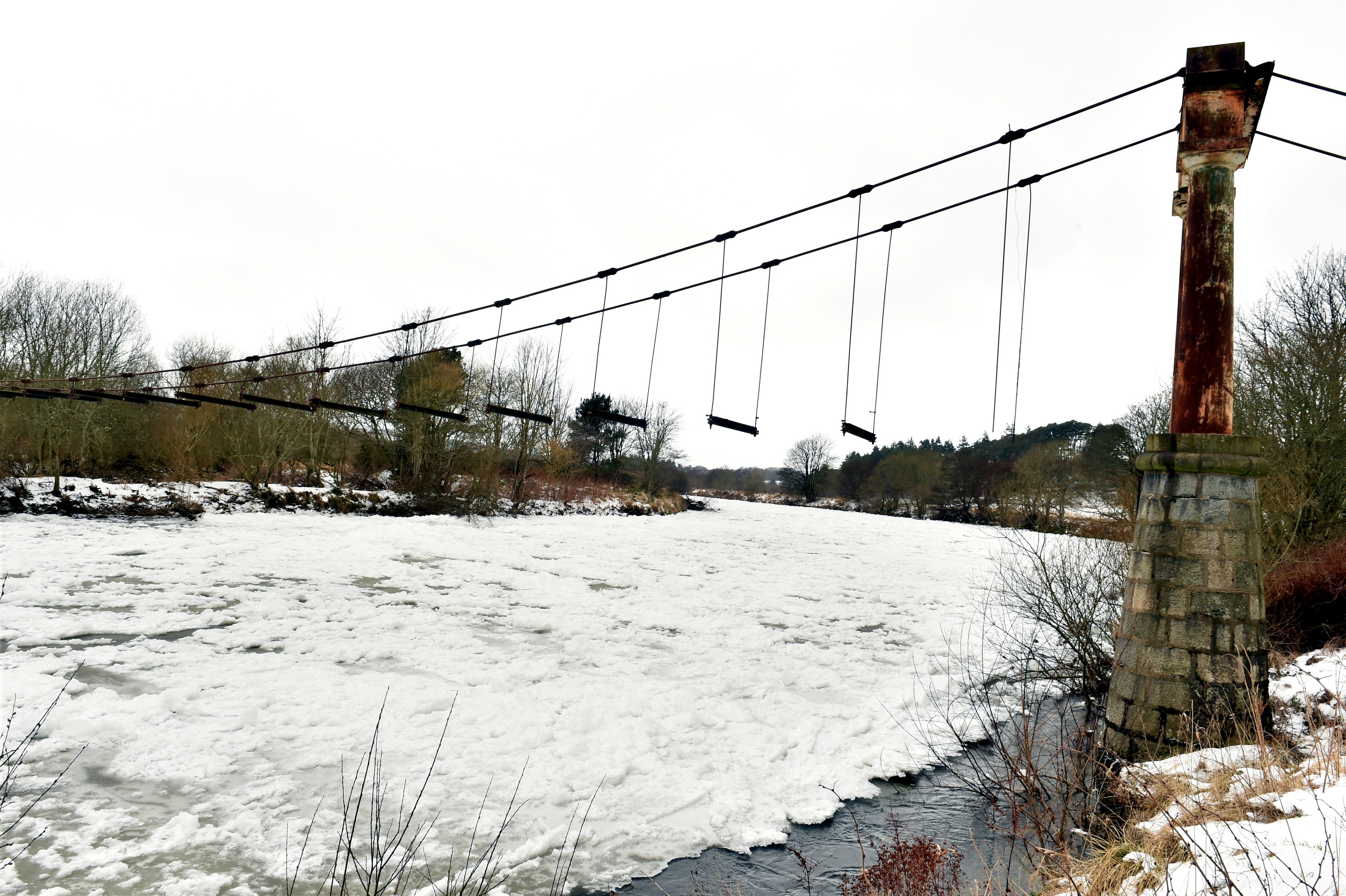 The Beast from the East - Ice covers the River Dee at the historic Shakkin Briggie - St. Devenick's Bridge which was a suspension footbridge which crosses the River Dee from Ardoe to Cults.