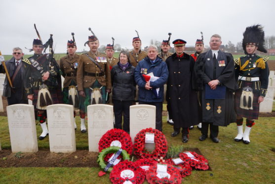 Ken and Kath MacDonald with the Reverend Paul van Sittert and members of the Royal Regiment of Scotland at the service.