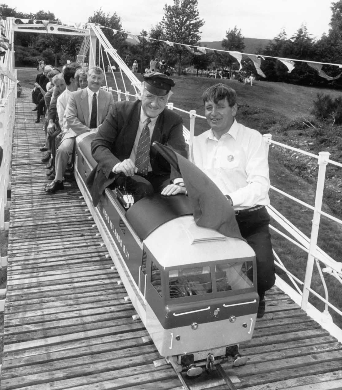 In the driver's seat yesterday at the Ness miniature railway at Whin Park, Inverness, is the late Sir Russell Johnston, MP for Inverness, Nairn and Lochaber between 1983 and 1997, as he is flagged off by Ian Young at the official opening of the Ness railway bridge in August 1989.