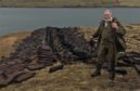 Bruce Wilcock perpetuates the tradition of cutting peat in Shetland.