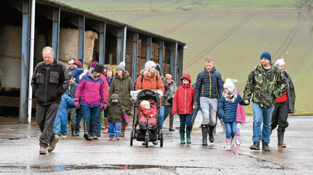 Visitors at the farm for one of its tours.