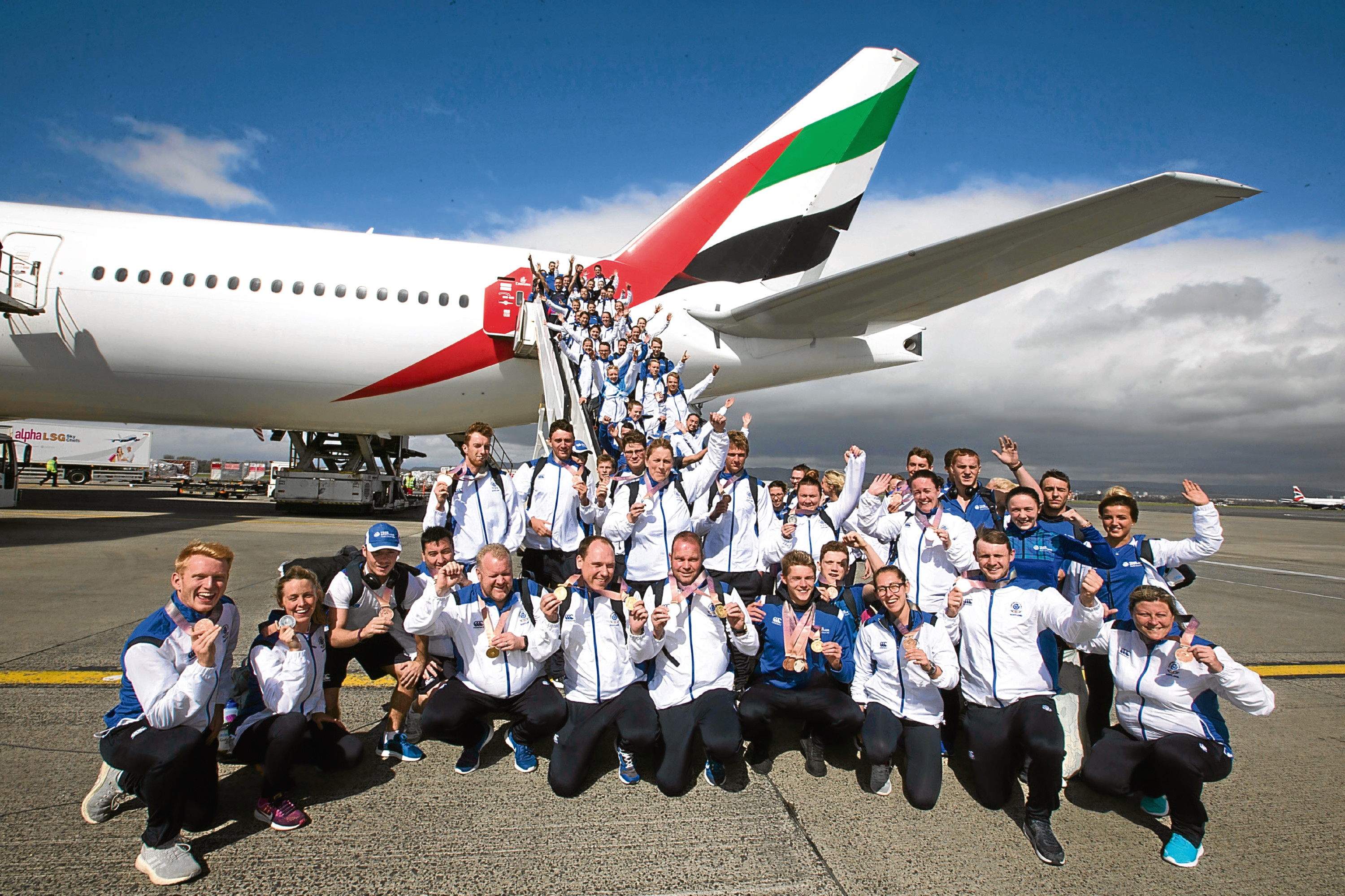 Handout photo dated 17/04/18 provided by Jeff Holmes of Team Scotland athletes arrive at Glasgow airport following the conclusion of the 2018 Gold Coast Commonwealth Games. PRESS ASSOCIATION Photo. Issue date: Tuesday April 17, 2018. See PA story COMMONWEALTH Scotland. Photo credit should read: Jeff Holmes/PA Wire. NOTE TO EDITORS: This handout photo may only be used in for editorial reporting purposes for the contemporaneous illustration of events, things or the people in the image or facts mentioned in the caption. Reuse of the picture may require further permission from the copyright holder.