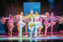 Lucie Jones as Elle Woods, centre, strutting her stuff with the dancers on stage