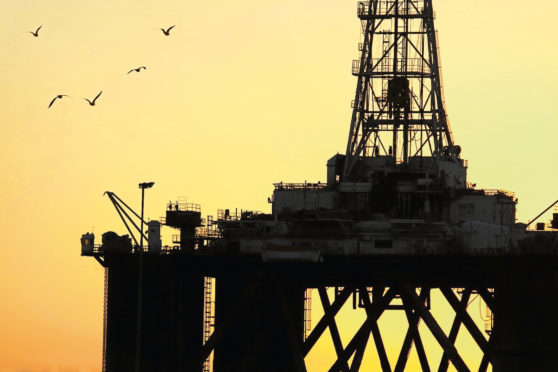 Silhouette of an oil rig 





sun rising setting generic black gold offshore birds platform