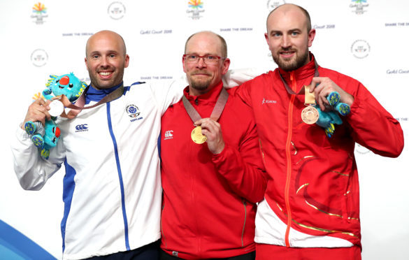 Aberdeen's Neil Stirton (left) with his silver medal. David Phelps (centre) took gold with England's Kenneth Parr earning bronze.