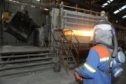 Fort William Aluminium Smelter. Casting Operator Michael Hartley at work pouring molten aluminium in the factory.
Picture by Sandy McCook.