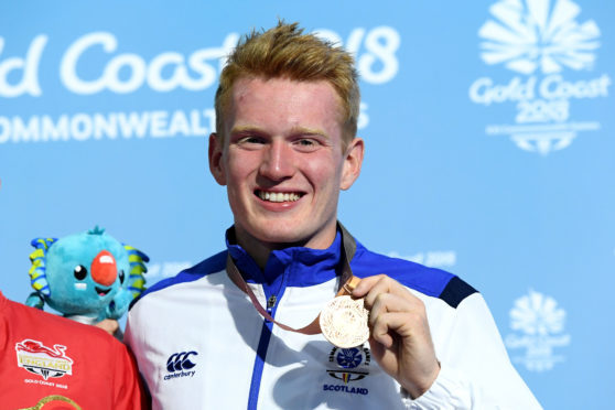 Bronze medalist James Heatly of Scotland poses during the medal ceremony for the Men's 1m Springboard Diving Final