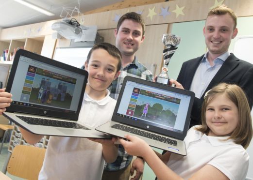 L-R Lucas Main and Aimmie Mills-both 9YO pr5 answered the most questions correctly in their class- pictured with their teacher Mark Clayson and Charles Mathias, Sumdog UK manager