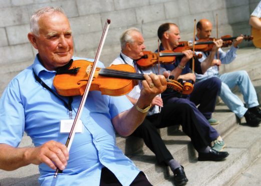 Angus Henry, John Henderson, Christopher Thomason and Danny Jamieson performing outside the Cowdray Hall for the 2006 North Atlantic Fiddle Convention. Picture by Peter Anderson