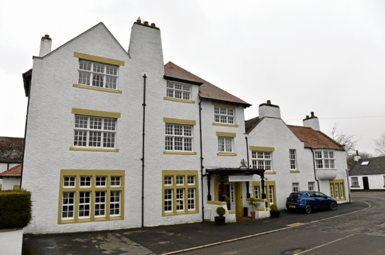 A couple “hung about” in the Ramsay Arms hotel arousing suspicion, hours before it was robbed