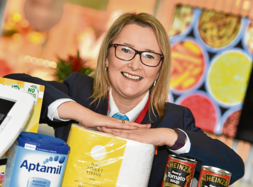 Customer service advisor Carole Manzies with some of the donations.