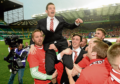 Peter Pawlett with his Dons team-mates after their League Cup final penalty shootout win against Caley Thistle in 2014