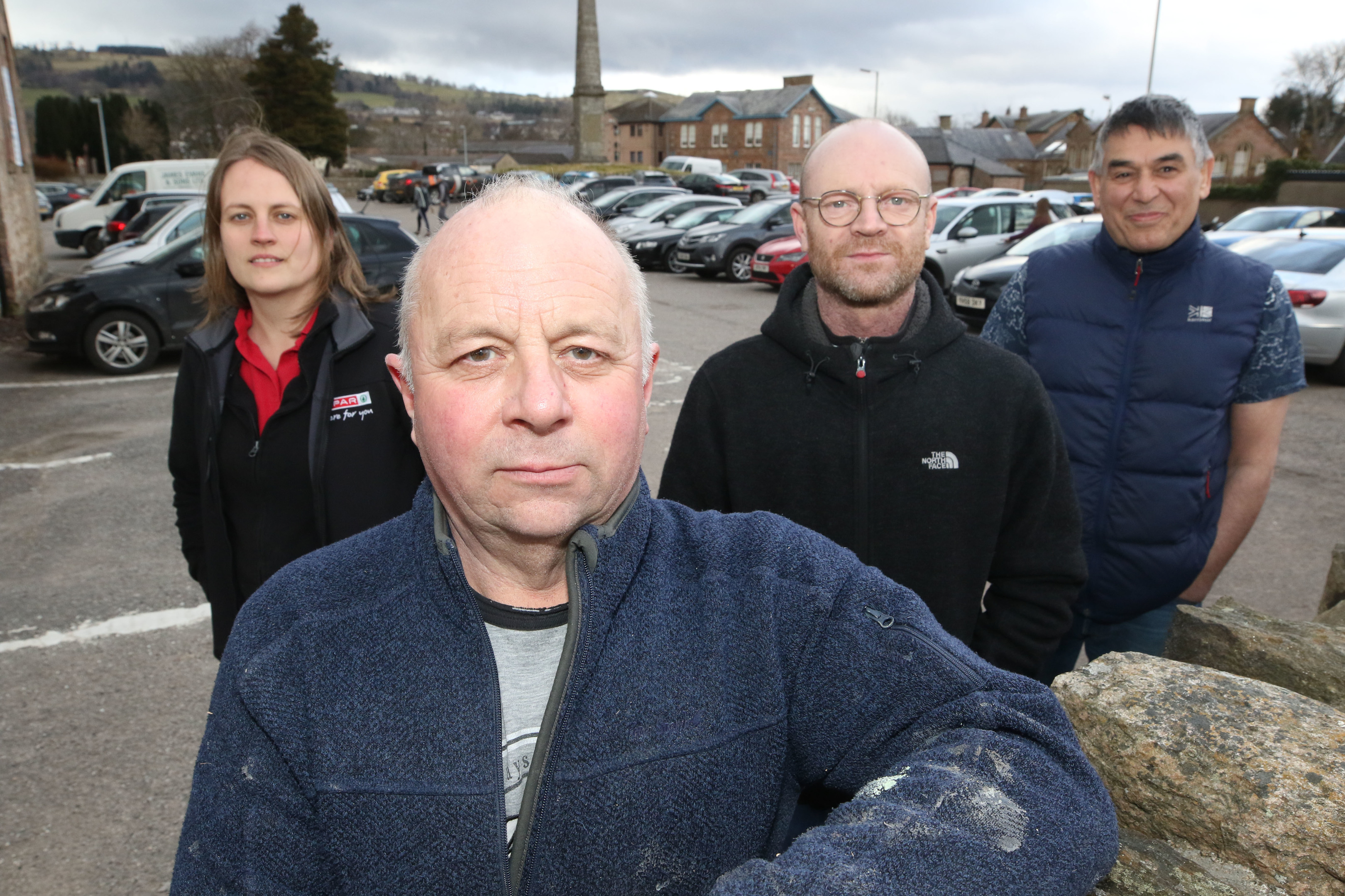 Local business owners in Dingwall are protesting against the proposed introduction of parking charges at the town's Cromarty Car Park. Left-to-right: Alicen Lawrie (correct), David Campbell, Graeme Dolier, Saeed Shirvani.