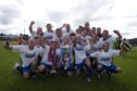The Inverness Caley Thistle players celebrate being crowned Bell's First Division champions in 2004.